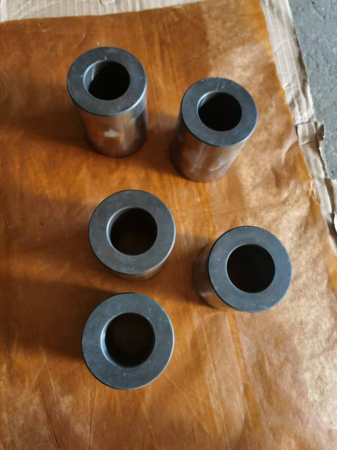 ALAS High-Wear-Resistance Rebar Bender Rollers and Sleeves Heavy-duty hardened steel rebar bending machine bushings and forming sleeves on protective paper