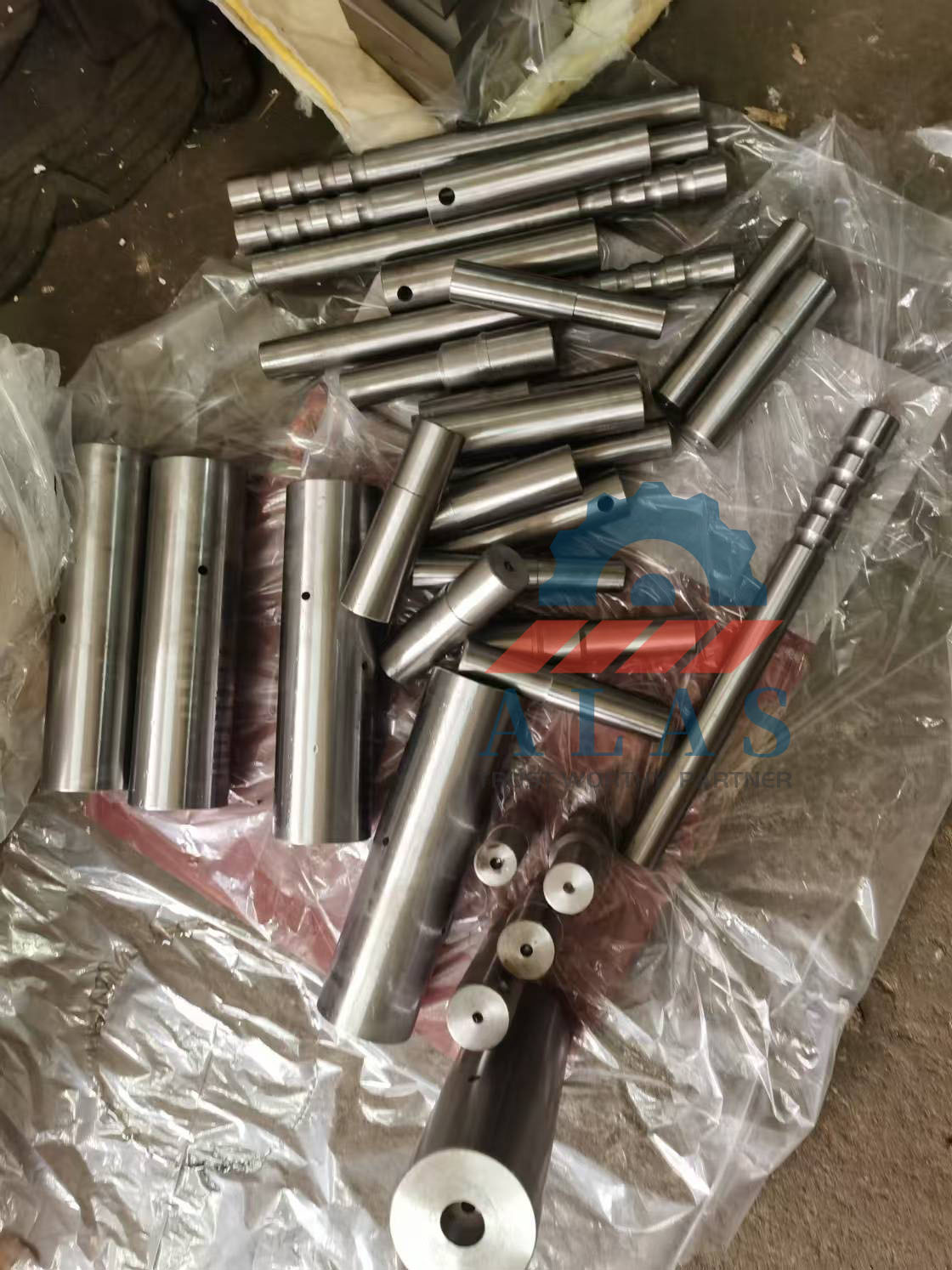 ALAS Custom Hardened Steel Rebar Bending Pins and Shafts Selection A collection of rebar bender replacement parts including center shafts, bending pins, and forming mandrels in various sizes