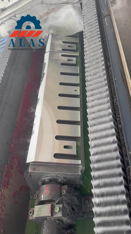 CNC Precision Surface Grinding for ALAS Industrial Chipper Blades A heavy-duty A8 steel wood chipper knife undergoing precision linear bevel grinding with cooling liquid at the Alas