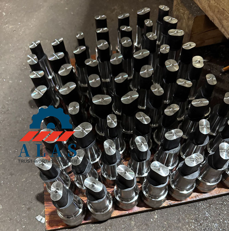 Mass Production of Custom Oblong Ironworker Punches A large batch of machined oblong ironworker punches organized on the factory floor