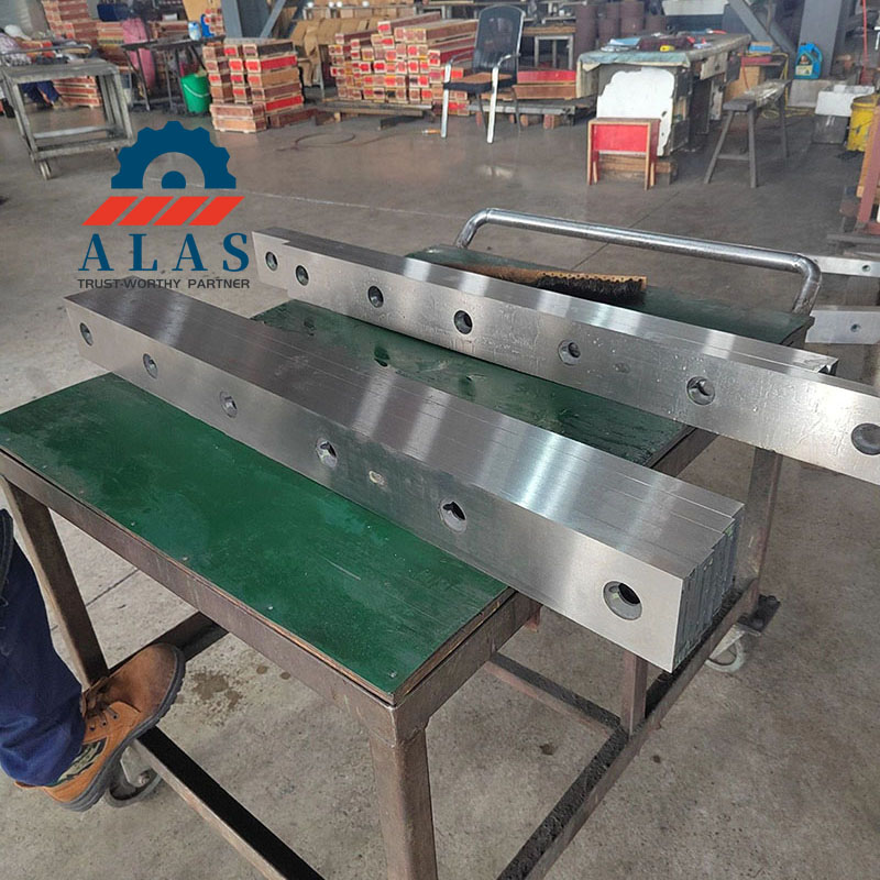 ALAS Wholesale Premium Steel Guillotine Shear Knives for Batch Orders A batch of heavy duty metal shear blades stacked on a workshop cart ready for quality inspection and shipping