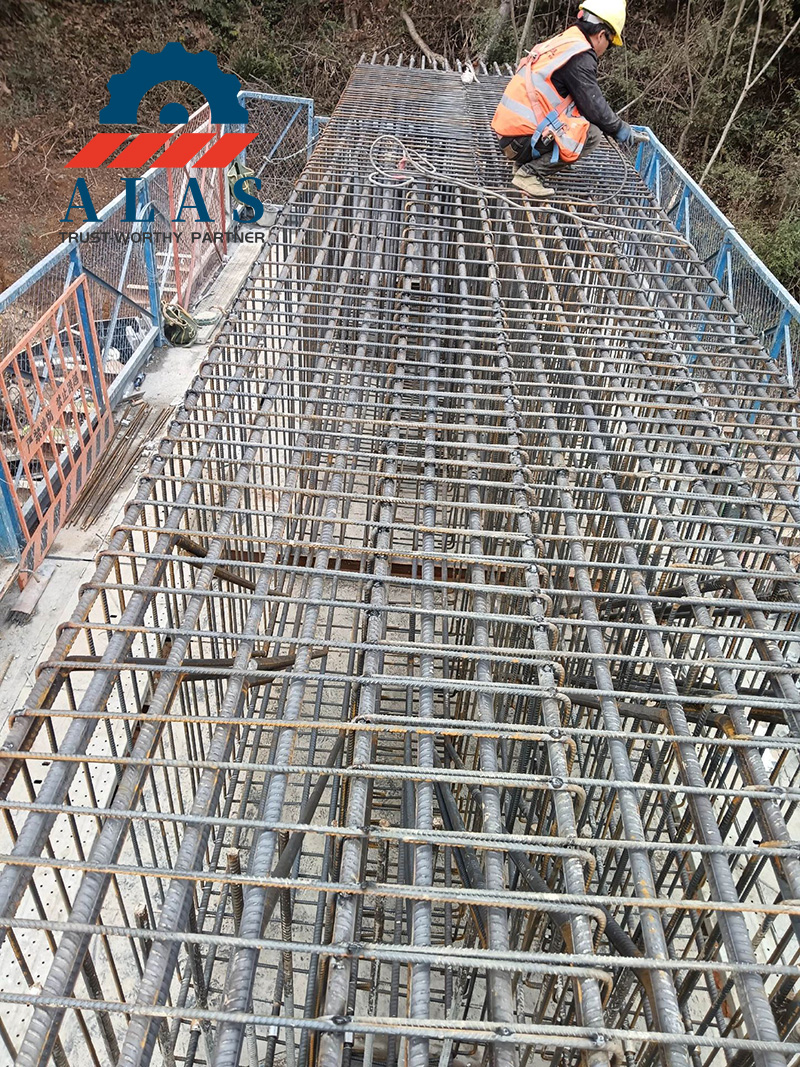 Industrial Rebar Shearing Site Application An industrial construction job site featuring a dense grid layout of high strength heavy duty ribbed rebar mesh for bridge reinforcement infrastructure