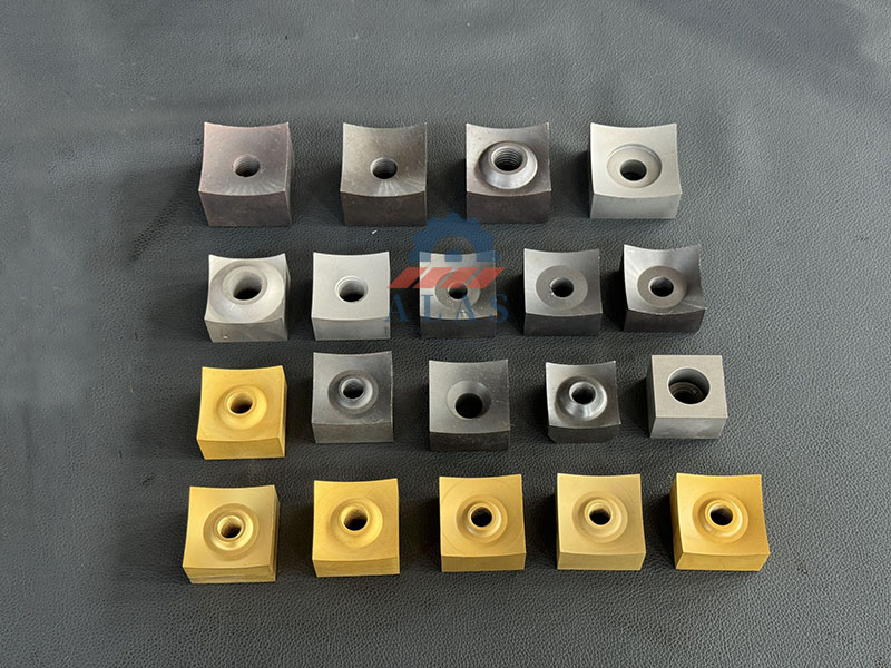 ALAS Various Sizes of Square Shredder Knives & Block Cutters A collection of square single shaft shredder blades and rotor knives in various sizes, including titanium-coated wear-resistant block cutters for industrial recycling