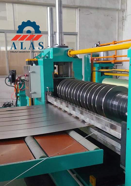 Circular Slitter Knives Slitting Application - ALAS High precision circular slitter knives installed on an industrial metal coil slitting machine cutting steel sheets
