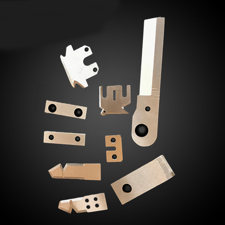 A collection of OEM custom special-shaped rubber cutting blades for industrial machinery.