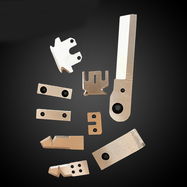 A collection of OEM custom special-shaped rubber cutting blades for industrial machinery.