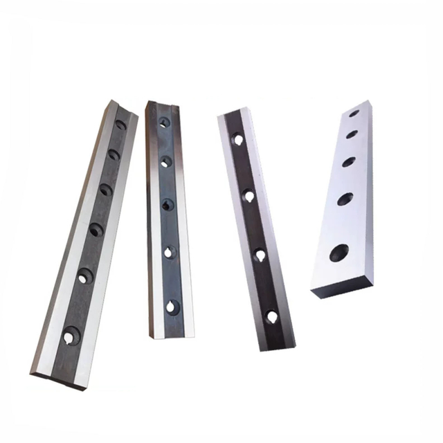 Industrial guillotine shear blades for high-tensile stainless steel sheet cutting.