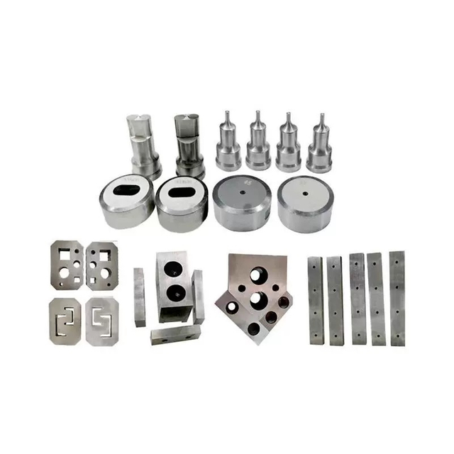 A complete set of ironworker tooling including punches, dies, and shearing blades