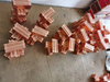 Concrete pile machine reinforcement clamp