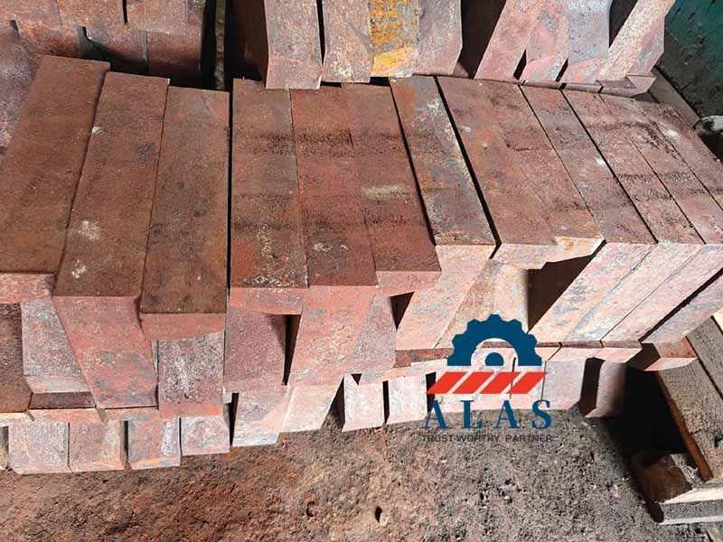 Forged hot-work tool steel blocks for heavy-duty rotary shear knives stacked in factory warehouse