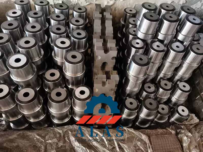 Batch inventory of precision-ground AISI D2 tool steel fixed cutting blades on a factory floor.