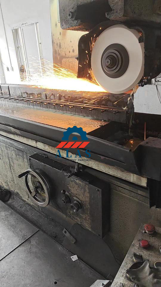 Precision regrinding process of a long guillotine shear blade using a heavy-duty surface grinder with cooling system