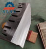 A massive stack of custom fabricated wood chipper anvils fresh from the factory floor