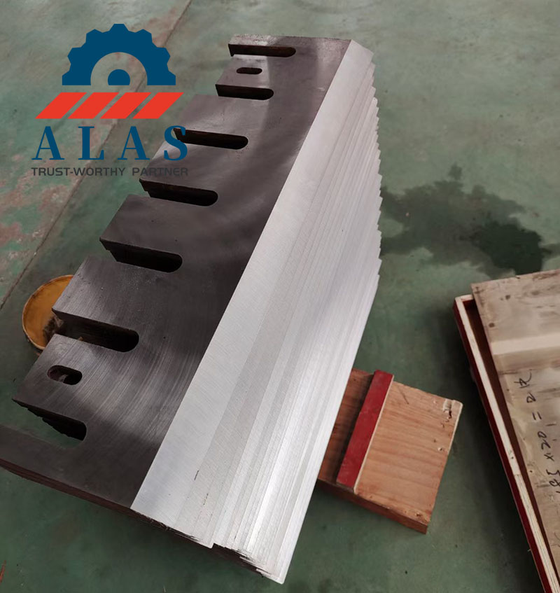 A massive stack of custom fabricated wood chipper anvils fresh from the factory floor