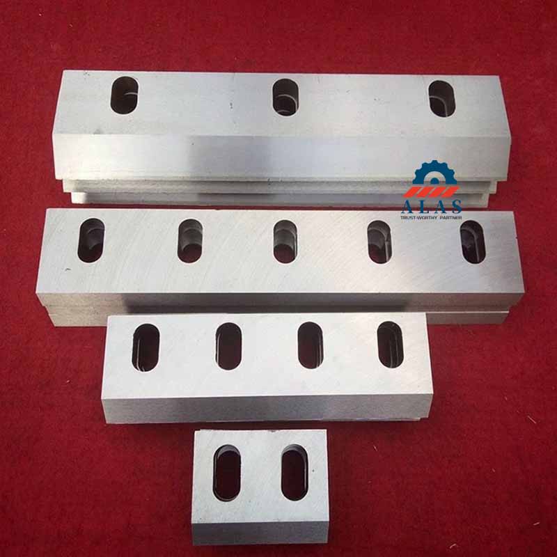 A premium kit of factory-direct replacement shredder knives and industrial shear blades showing clean counterbores.