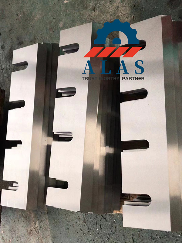 Finished batch of premium drum chipper blades held to 0.02 mm thickness tolerance
