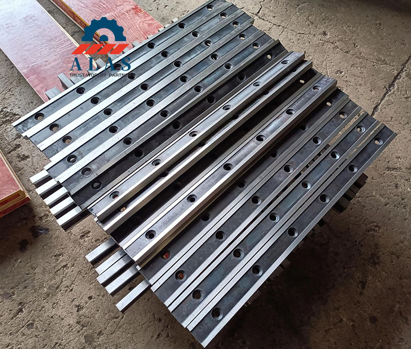 Batches of high-precision thin sheet metal shear blades stacked inside the warehouse.