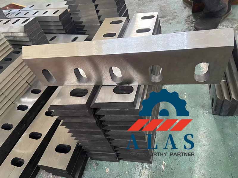 Front view of an application-matched 5-slot flat plastic crusher machine blade with fine-ground rake faces to reduce cutting friction.