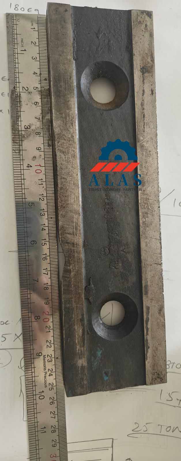 Severe edge chipping and facial wear deformation on a used alloy steel scrap metal shear blade