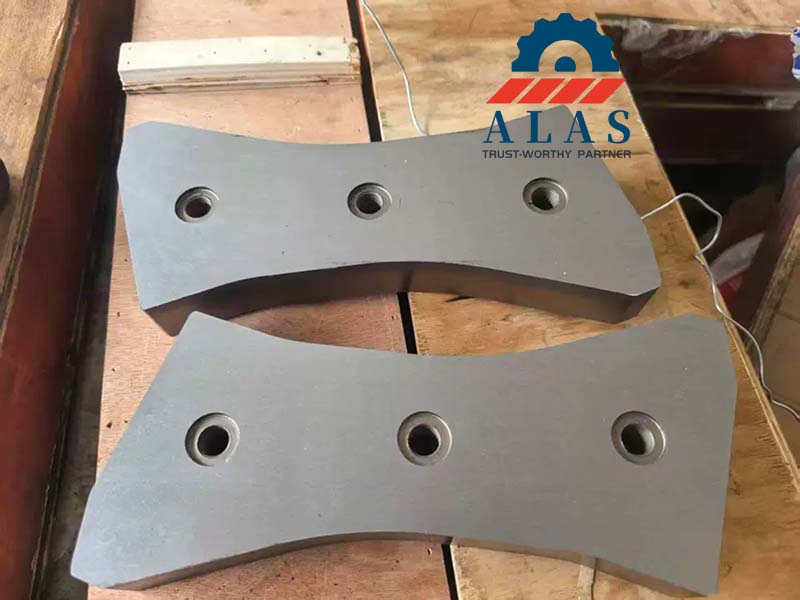 A pair of heavy duty demolition shear piercing tips with precision counterbored holes