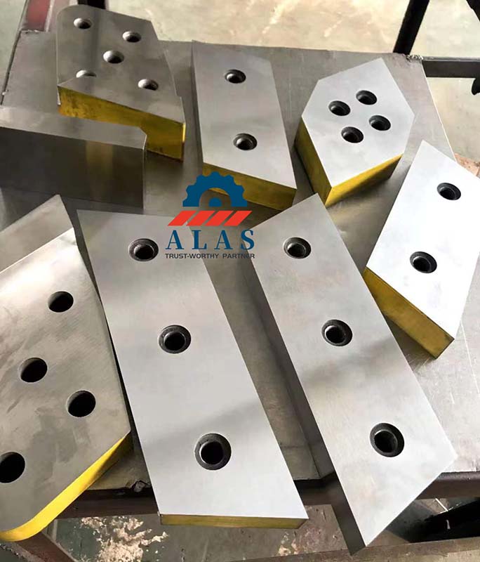 Precision ground rectangular shear blades with yellow protective edge lacquer and countersunk mounting holes