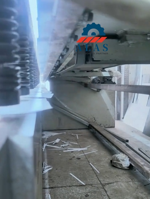 Heavy-duty sheet metal shearing line running with custom replacement blades.