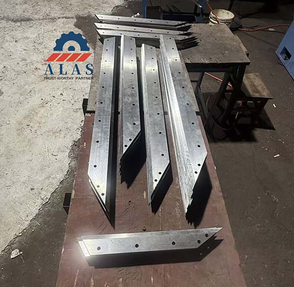 Precision manufactured straight cutting blades with mounting holes for FIBC bulk bag unloader systems