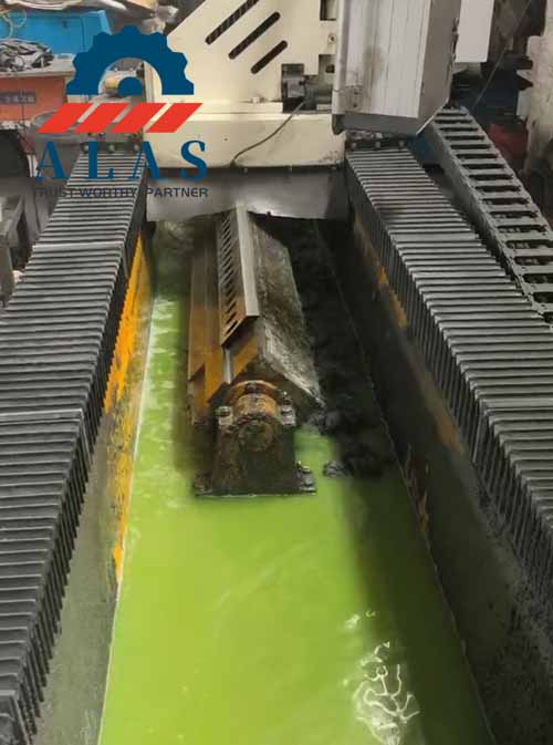 CNC automated vertical grinding center processing A8B modified tool steel chipper blades under constant liquid flood cooling