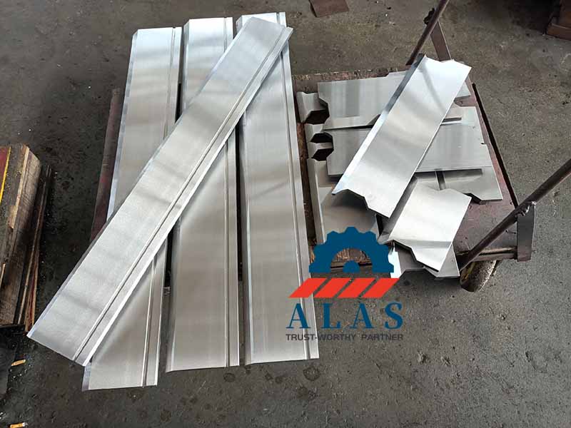 ALAS CNC precision ground standard straight press brake punches and sectional upper tooling modules stacked on a factory cart.