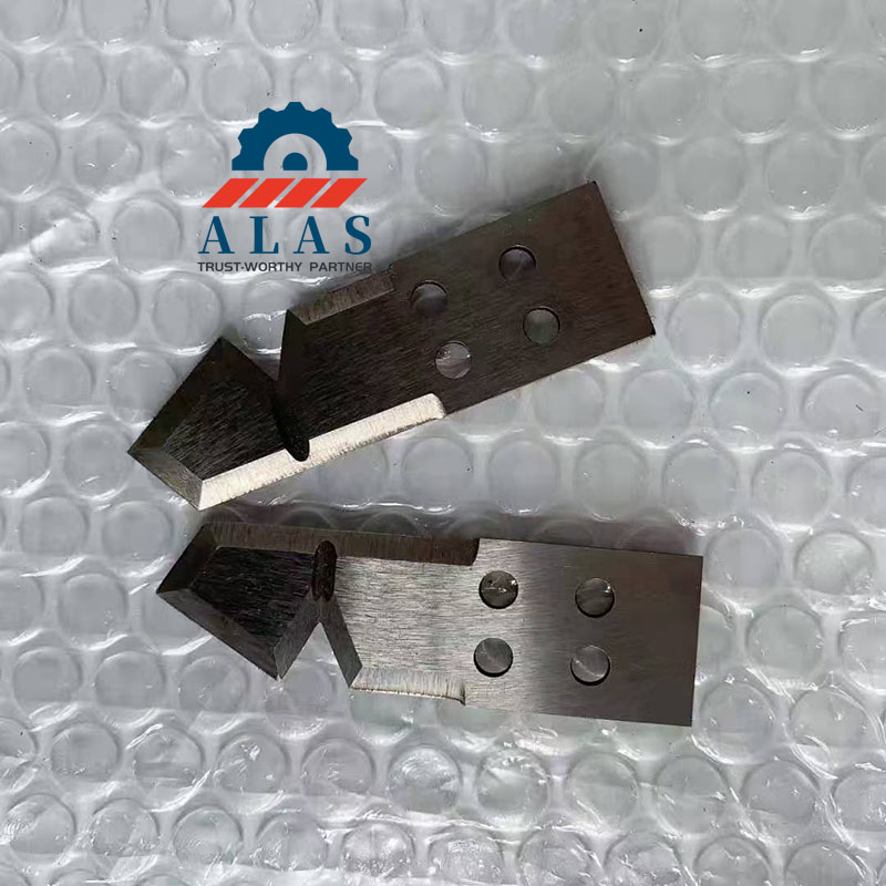 ALAS heavy duty 4-hole tire cutting blades and industrial hydraulic shear knives placed on a protective bubble sheet