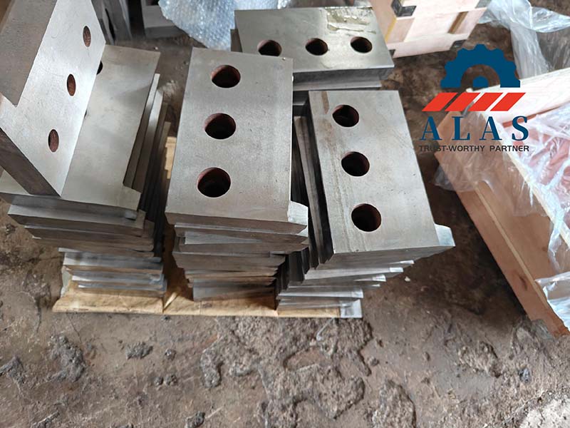 Bulk run of through-hardened flying shear knife blanks awaiting vacuum heat treatment on workshop pallet