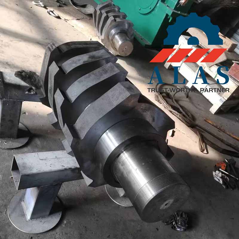 A heavy-duty twin-shaft shredder rotor assembly being aligned on the workshop floor for municipal solid waste processing