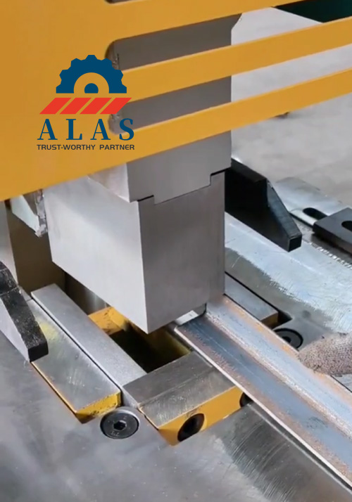 Heavy-duty ironworker cutting structural channel steel