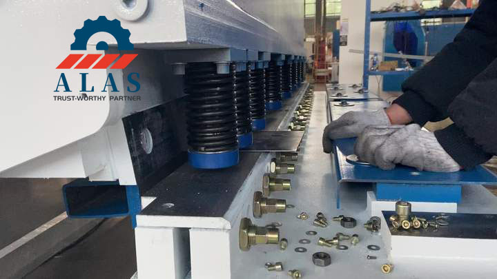 ALAS Strict Clearance Calibration for Flawless and Straight Metal Shearing Experienced technician adjusting a long high carbon steel shearing machine blade on a hydraulic guillotine shear