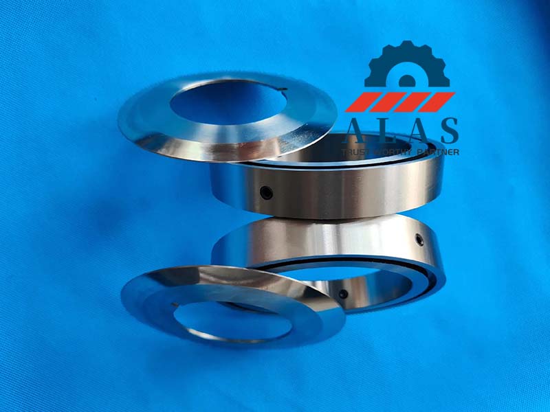Industrial multi-grade packaging slitter knives arranged with matched alloy steel female bottom knives and locking screws.