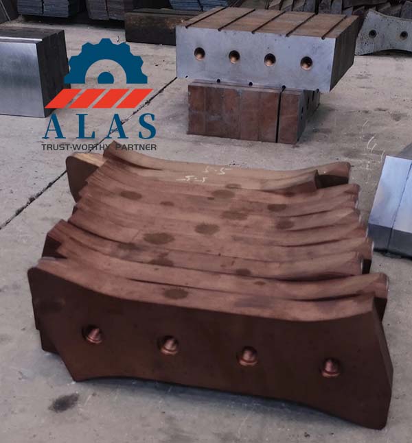 Batch stack of vacuum heat treated mobile scrap shear blades awaiting final grinding