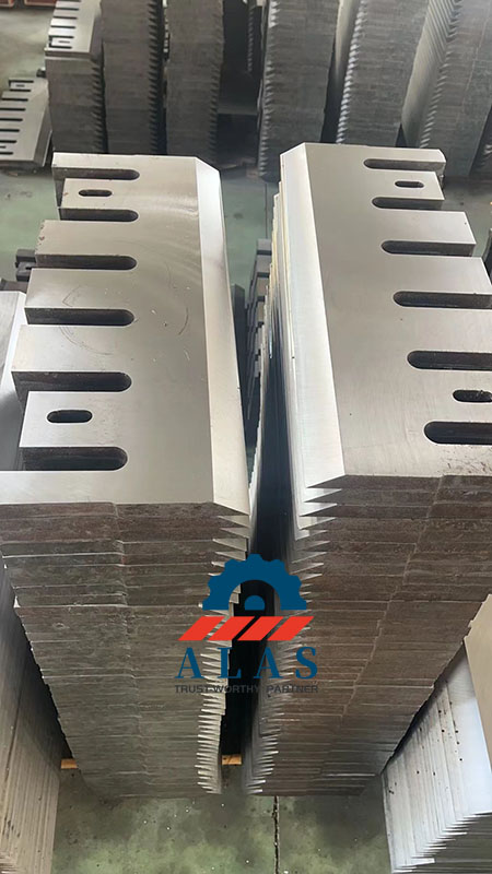 Finished batch inventory of precision ground wood chipper blades stacked at the Nanjing ALAS Machinery factory floor