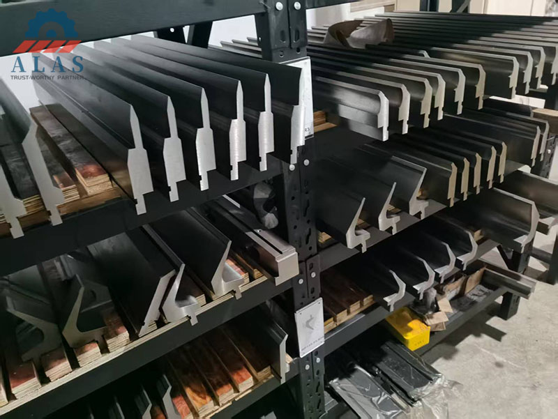 Industrial press brake punch and die sets inventory with various bending punches and custom brake dies on factory shelves