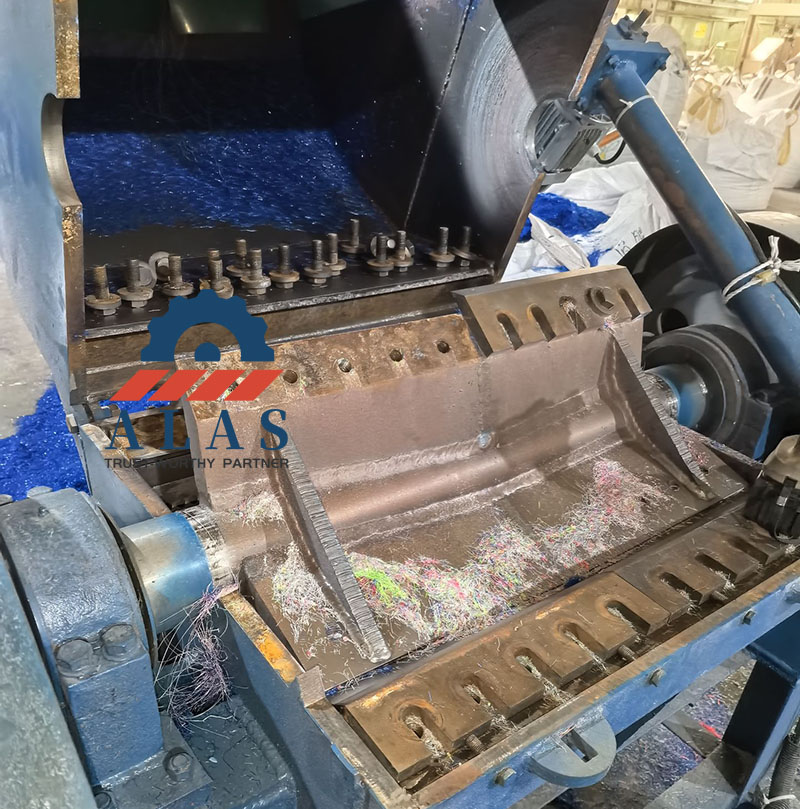 Internal rotor assembly of an industrial wood chipper machine showing custom knives and counter blades installation