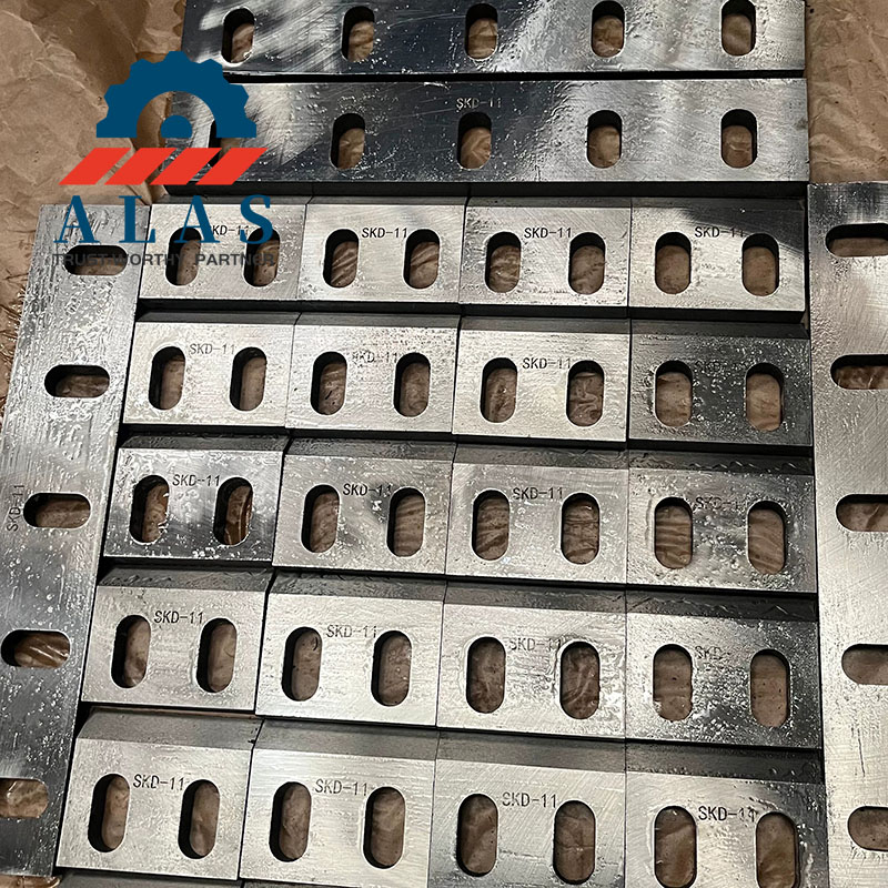 Bulk stock of precision-ground SKD-11 plastic shredder blades with custom bolt slots