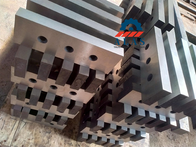 Heavy duty scrap metal shear blades stacked in factory manufactured by ALAS Machinery