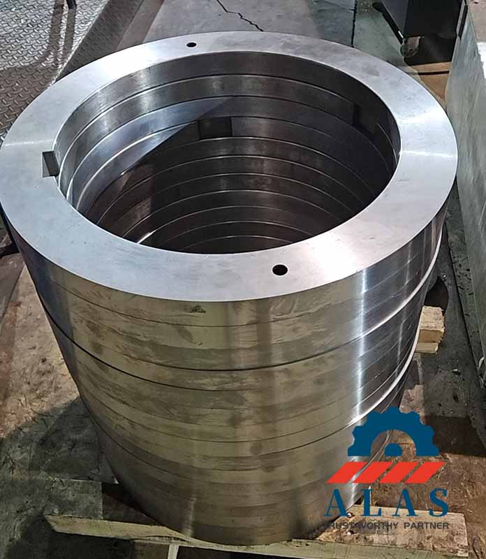 A stack of finished high-precision slitter spacers with internal keyways engineered to eliminate axial stack-up errors for LD blades.