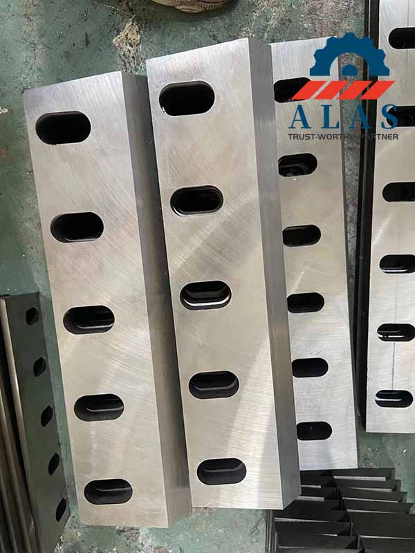 A neat stack of precision CNC ground DC53 granulator bed knives showing linear flatness