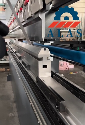 ALAS precision ground segmented acute punches aligned flawlessly above a matching lower tooling block on a long-bed press brake.