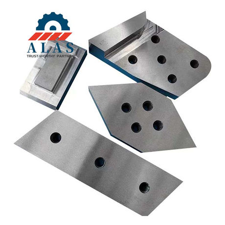 Replacement excavator shear blades, guide block, and heavy demolition piercing tip with multi-hole coordinates.
