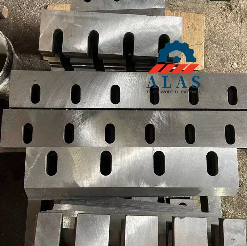Industrial plastic crusher blades laser-marked with 9CrSi steel grade stamp stacked in factory