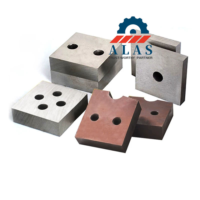 An assortment of custom bar cutter blades including vacuum-hardened H13 and D2 alloy 