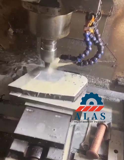 Precision CNC milling and grinding process for mobile scrap shear blades with coolant delivery.