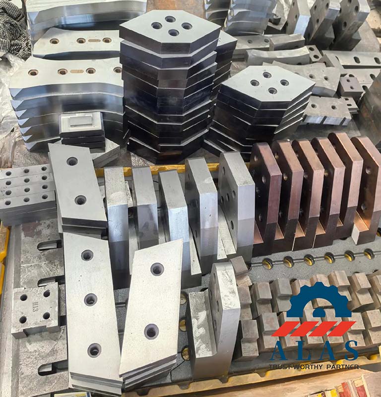 Batch stock of CNC ground H13 and H13K tool steel scrap shear blades awaiting final quality inspection