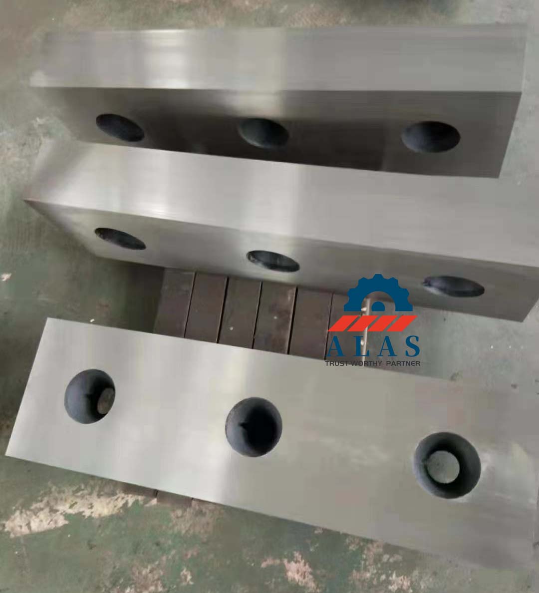 Precision ground alligator shear knives featuring tight parallel flatness and calibrated mounting apertures